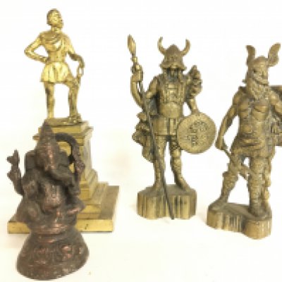A collection of figures including A pair of gilt bronze viking figures, Ganesh, Francis Drake.