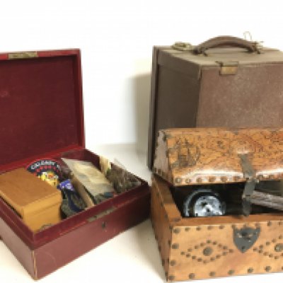 A collection of vintage compasses, military buttons, badges etc