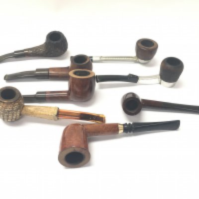 A collection of 8 old smokers pipes.