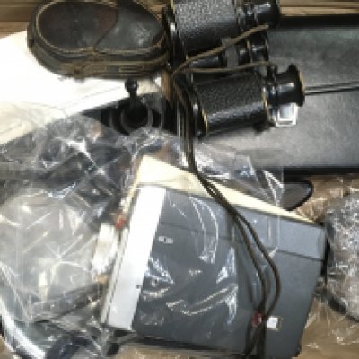 A box containing binoculars, parker fountain pens including a 14k gold tipped example, leather cased Volt meter, Minolta AF-3 & Ebony items including a hand mirror, corkscrew. This lot cannot be posted