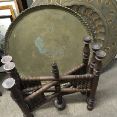 Two early 20th century Middle Eastern brass top tables with a folding base