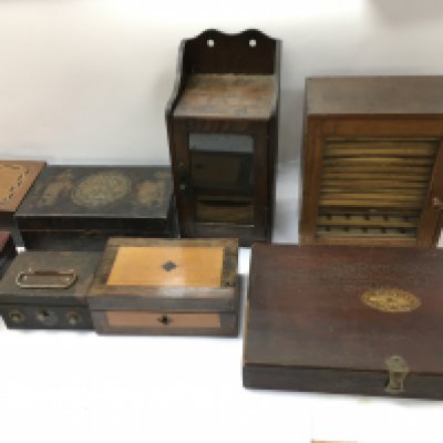 An assortment of vintage wooden boxes including a small glass fronted collectors cabinet.