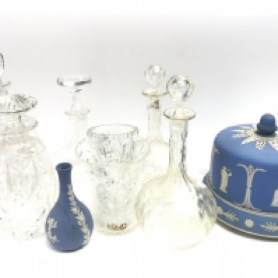 A Wedgwood vase & cheese dish, A collection of cut glass decanters including Rowland ward, Stuart and other vases. This lot cannot be posted