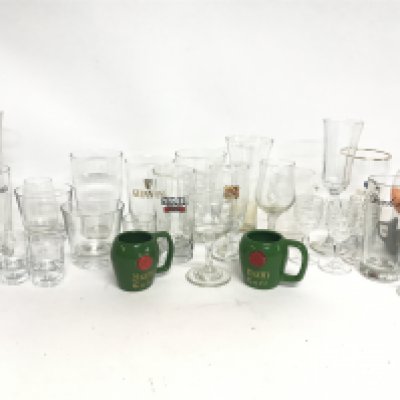 A Collection of vintage drinking glasses including Gordons, Guinness, Skol, Dom Cafe small mugs etc. This lot cannot be posted. NO RESERVE