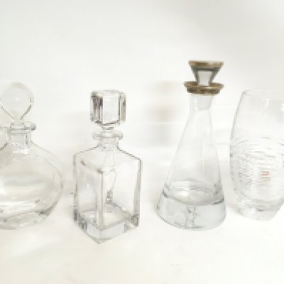 A collection of decanters including one with a silver hallmarked Topped lid and rim. This lot cannot be posted. NO RESERVE
