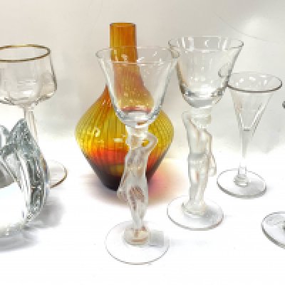 Group lot (7). Daum crystal candle holder, 2 Heinrich Hoffman lady stem glasses, Pair of Victorian port glasses, A Harrach Intaglio cut glass and gilt rimmed glass, c1890, Jan Gabrhel for Chlum u Trebone garnet hand blown vase, 16.5cm. (D In-house postage is not available for this lot).