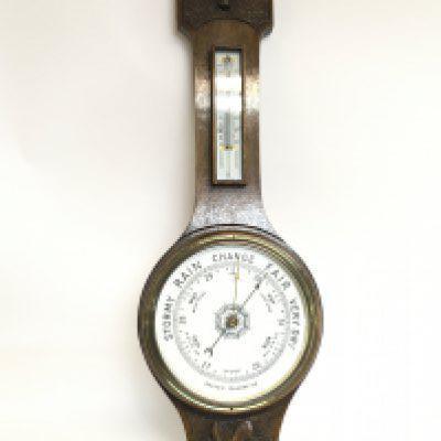 An oak barometer with a damaged mercury box, 80cm tall .this lot cannot be posted. NO RESERVE