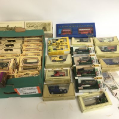 A collection of boxed die cast vehicles including days gone and matchbox. Also including some cigarette cards. NO RESERVE