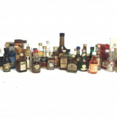 A Collection of whisky miniatures including Grandye, Bulls eye, Dewars, Glenmorangie, The Dalmore and other miniature spirits. This lot cannot be posted. NO RESERVE