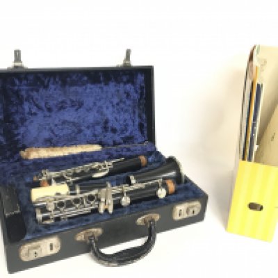 A cased F Bussion Dallas model 90 bayonet and a collection of clarinet books. Postage category C. NO RESERVE