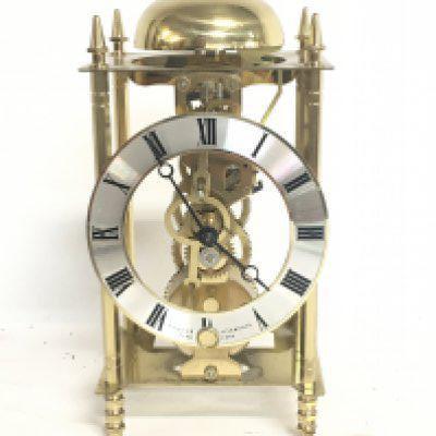 A Sewills skeleton brass mantle clock, 24cm tall approximately. postage category C- NO RESERVE
