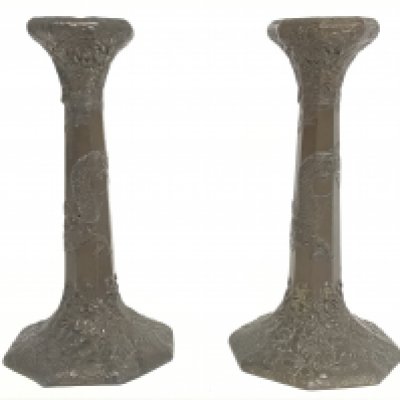 A pair of Japanese metal candlesticks decorated with dragons and flowers. 23cm tall. Postage category c. NO RESERVE