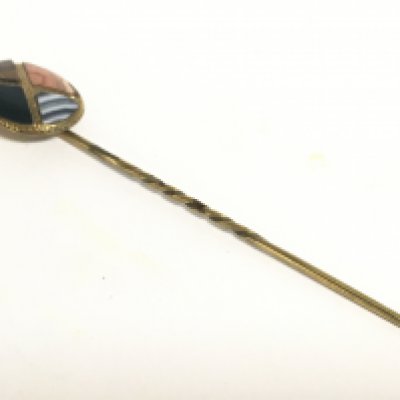 A 9ct Scottish gold agate stickpin, 1.9g. Postage category A- NO RESERVE