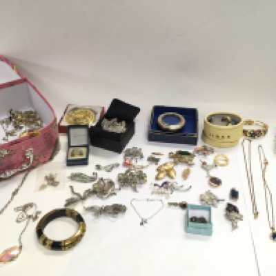 A collection of costume jewellery and silver items including brooches necklaces etc.- NO RESERVE