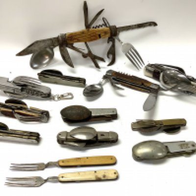 A stag horn bodied multi tool pocket knife together with similar examples.