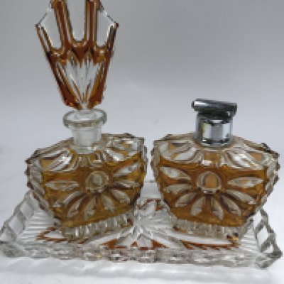 A Art Deco glass perfume bottle with matching atomiser and tray .