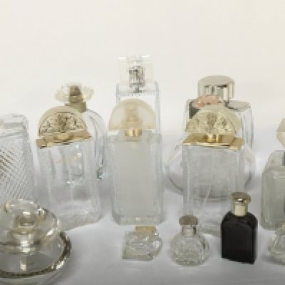 A collection of quality Lalique and other designer glass scent bottles.