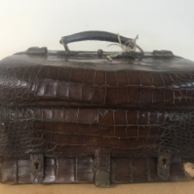 A Gladstone Alligator bag with brass locks