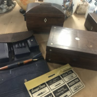 A Georgian mahogany tea caddy together with a sewing box and leather stationery case