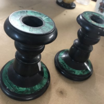 A pair of malachite and slate candlesticks