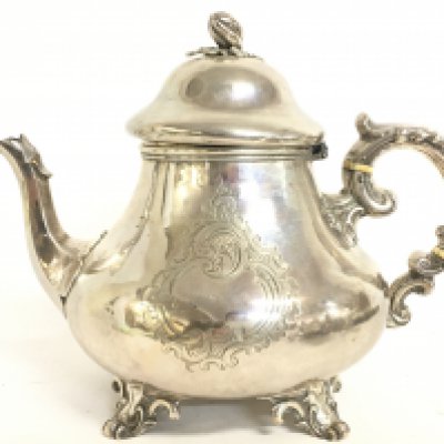 A Victorian silver hallmarked tea pot, 20cm tall approximately. Postage category C