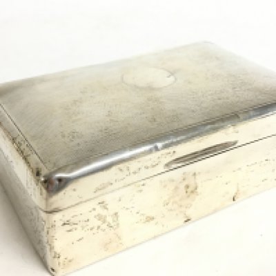A silver hallmarked cigarette box by Alex R Clark. Postage category B