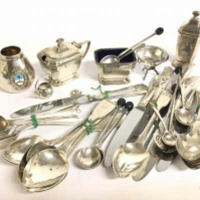 A collection of silver hallmarked items including spoons, knives, cruet set. Postage category B