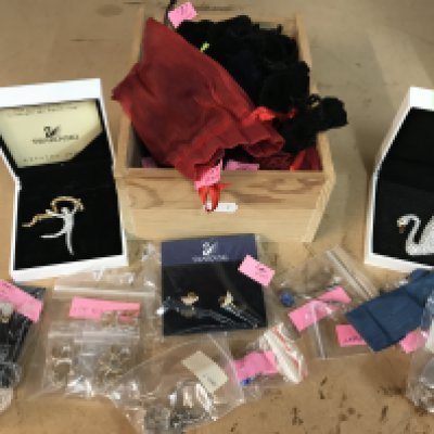 A collection of Swarovski brooches, tie pins, key rings etc