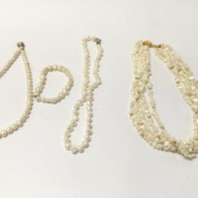 A collection of natural pearl necklaces and a bracelet. Postage B