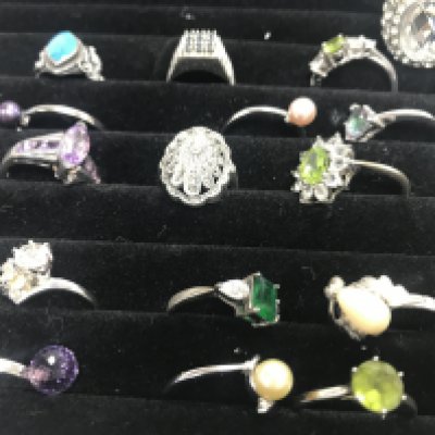 A collection of modern design rings including silver .