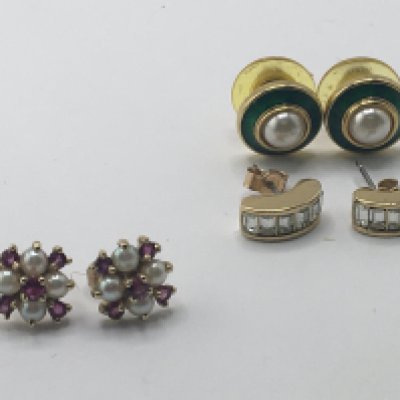 A pair of 9carat gold earrings set with pearl and garnet stones and two other pairs of gold plated dress earrings.