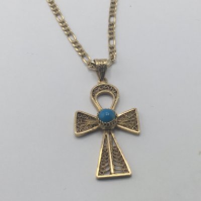 An 18carat gold gold open link necklace with attached gold filigree cross set with turquoise. Weight 13.5