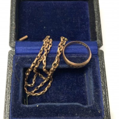 A 9ct gold ring together with a 9ct gold chain. (A)