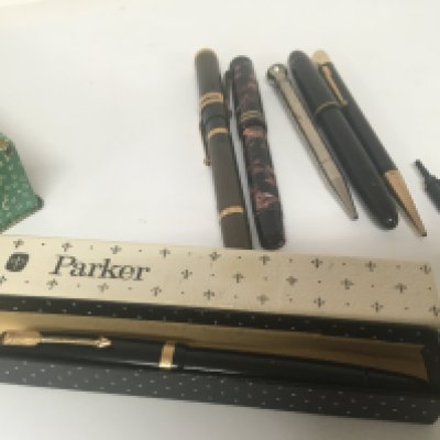 A Tin containing Vintage fountain pens.