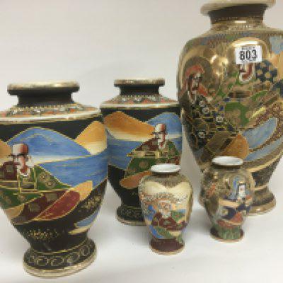 A collection of Satsuma porcelain vases decorated with figures and applied gilt. Largest vase 38cm.