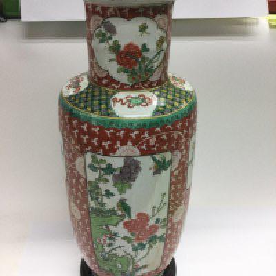 A pn Oriental vase decorated with birds and flowers and raised on a hardwood stand, approx total height 47cm. Shipping category D.