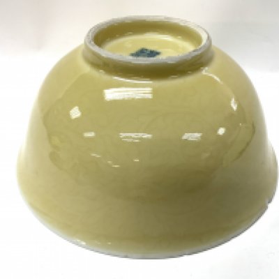 A Large yellow ground Chinese porcelain bowl with incised Lotus decoration, Underglazed 4 character mark to the underside. 23cm diameter x 11cm. (Some chipping to the rim), Catagory D postage. NO RESERVE