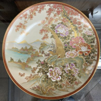 A Japanese Satsuma wall plate, signed to the back. 31cm (D)