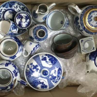 A collection of oriental blue and white porcelain including 18th Century tea pot, tea bowls, side dishes etc
