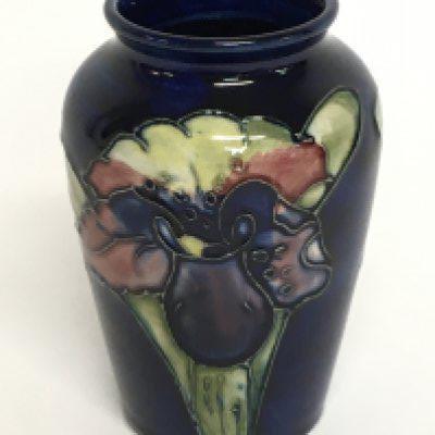A small Moorcroft vase, 9.5cm tall. No obvious damage or restoration, this lot cannot be posted. NO RESERVE