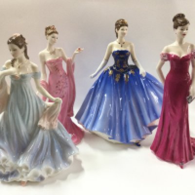 Four Doulton lady figures.
