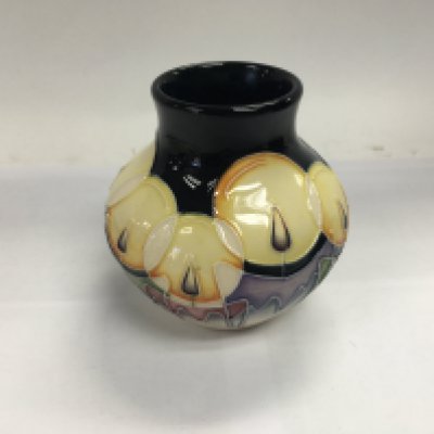 A Moorcroft Christmas candlelight vase.