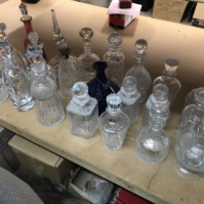 A collection of mixed decanters including some collared and cut glass examples. Approximately 21decanters.