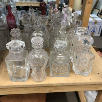 A large collection of decanters including cut glass examples. Approx 20 decanters.