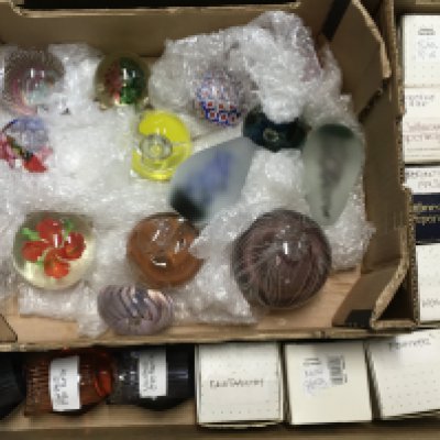 A collection of paperweights, vintage eye baths, Caithness Boxed paperweights. This lot cannot be posted