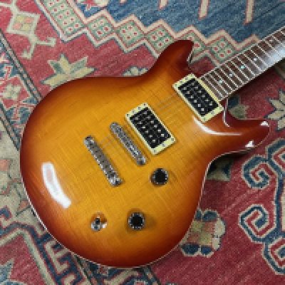 A 2000 Yamaha MSG Standard solid body electric guitar with Flame Maple Top and Rosewood Fingerboard in very good overall condition. Very little fretwear or playwear and plastic still on the control cavity cover. Comes with original case.