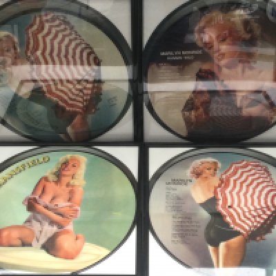 Four framed 12inch picture discs comprising three Marilyn Monroe examples and one of Jayne Mansfield.