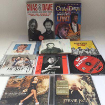 A collection of signed CDs and music DVDs including Stevie Nicks, Kris Kristofferson, Kenny Rogers and others.
