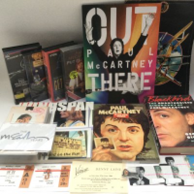 A collection of Paul McCartney & Wings ephemera comprising tickets, programs, books, t shirt, videos etc. Includes a Denny Laine gig ticket numbered 01.