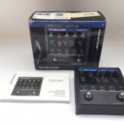 A boxed TC Helicon Voicetone effects pedal.